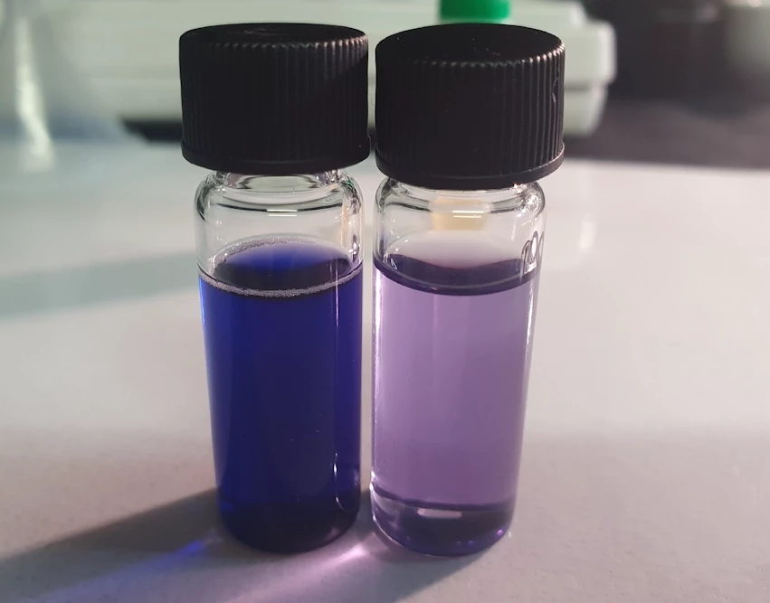 LSD Test Kit Results: Low vs High LSD Concentration LSD test kit results showing two vials: one with a faint color indicating low LSD concentration and one with a strong color indicating high LSD concentration.
